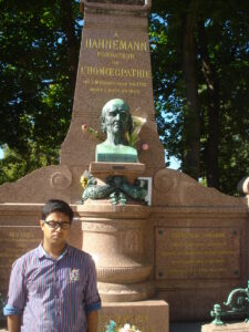 Dr Saptarshi Banerjea at Mont Martre Cemetery in Paris, paying homage to Master Hahnemann