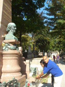 Dr Saptarshi Banerjea and Dr Subrata Banerjea paying homage to Master Hahnemann in Paris with flowers